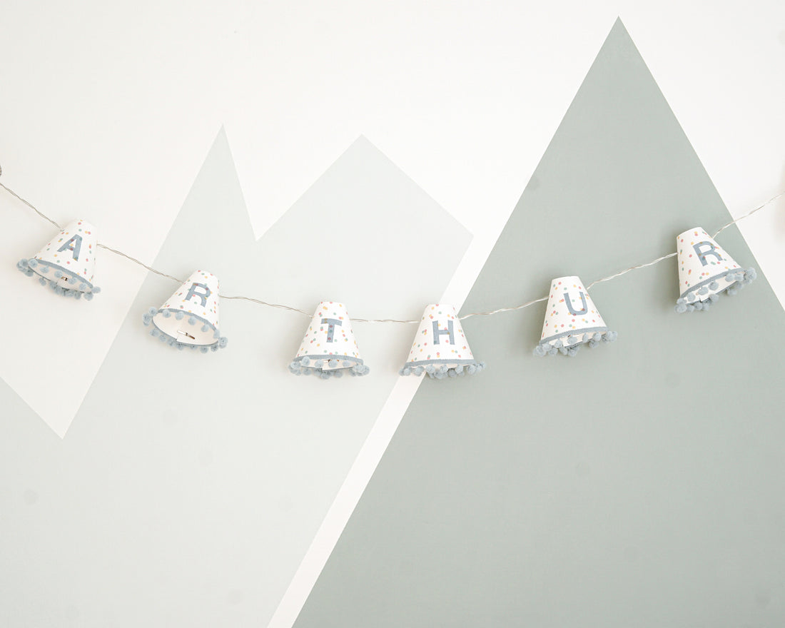 Personalised pom pom fairy lights in blue