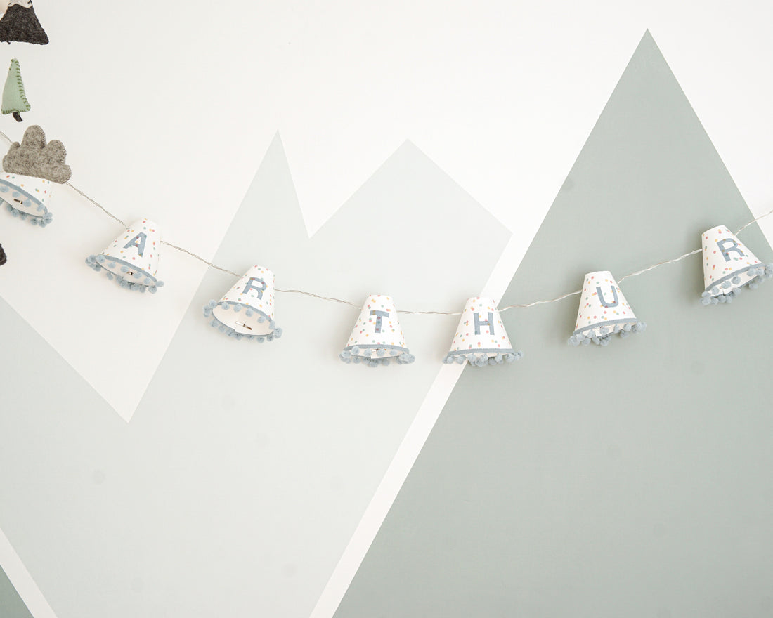 Personalised pom pom fairy lights in blue