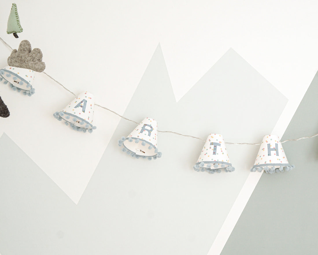 Personalised pom pom fairy lights in blue
