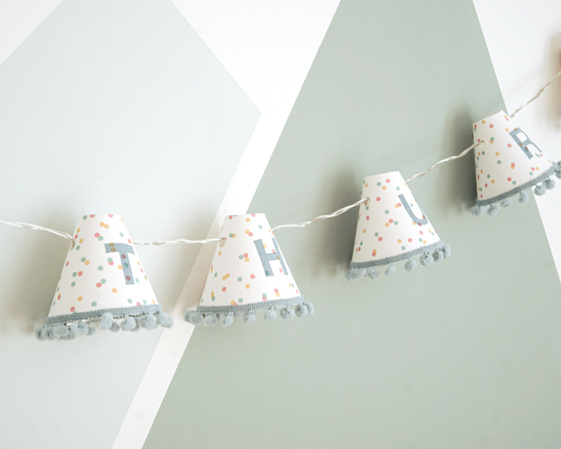 Personalised pom pom fairy lights in blue