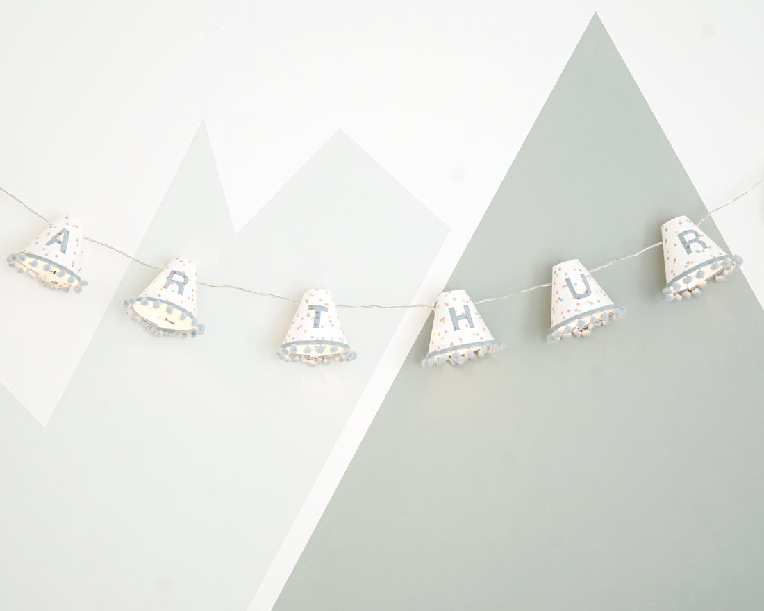 Personalised pom pom fairy lights in blue