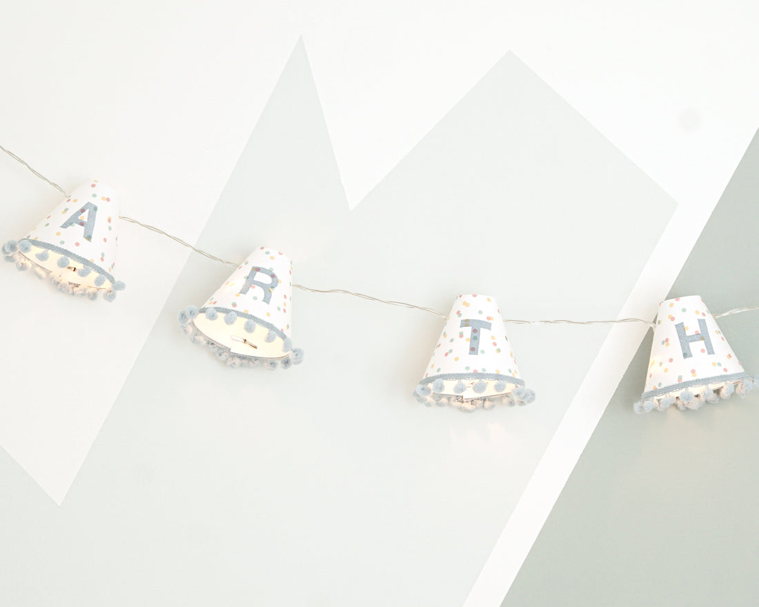 Personalised pom pom fairy lights in blue