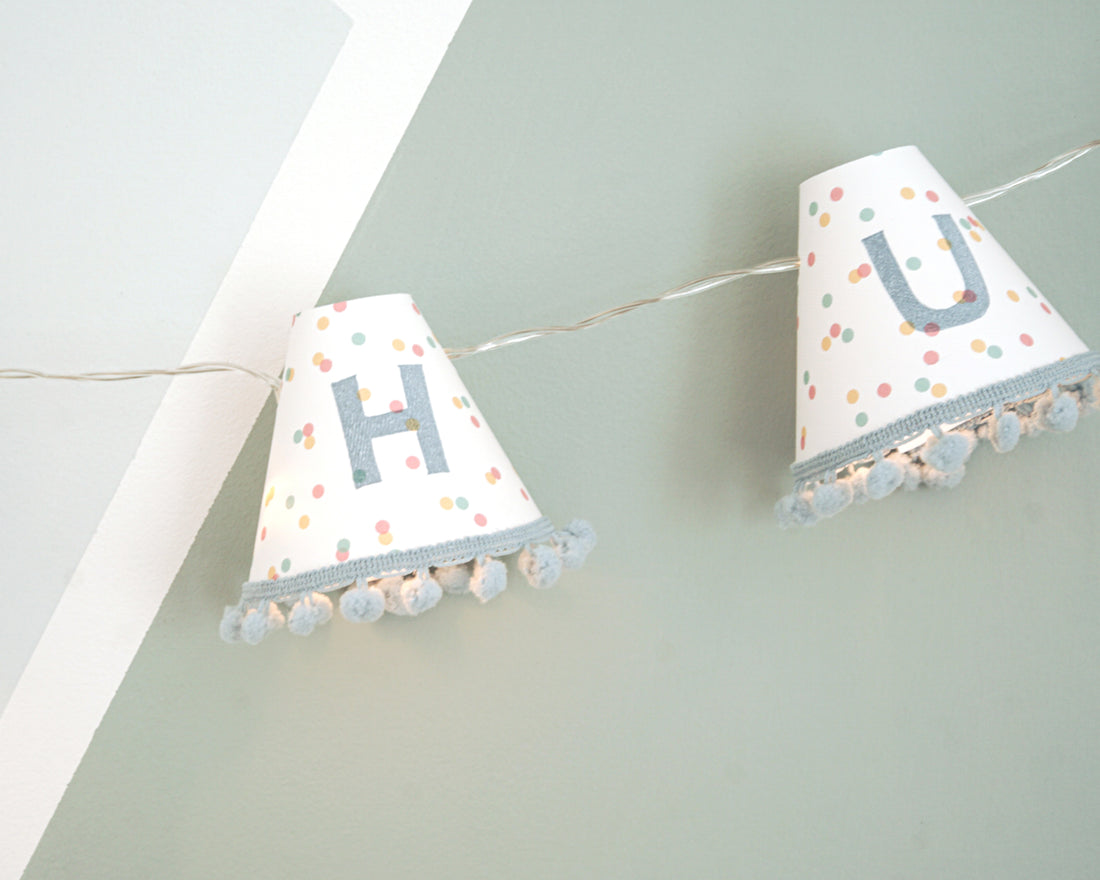 Personalised pom pom fairy lights in blue