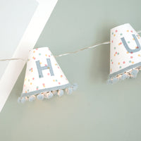 Personalised pom pom fairy lights in blue