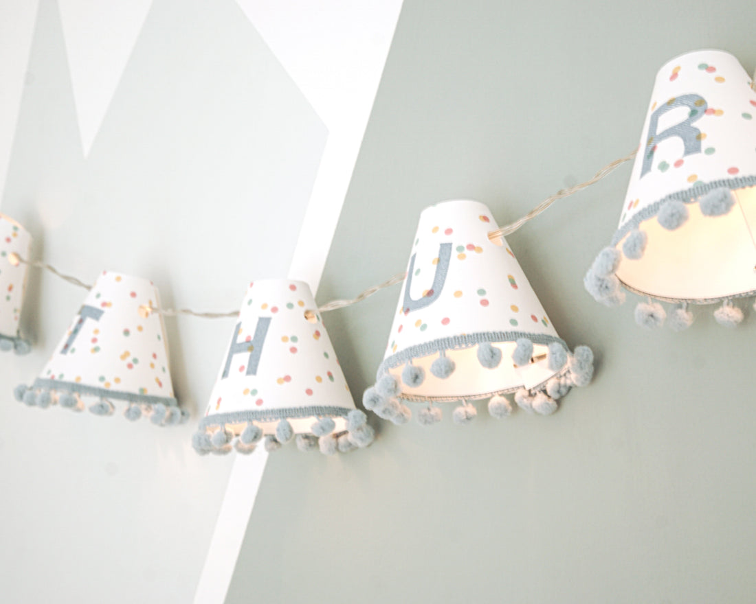 Personalised pom pom fairy lights in blue