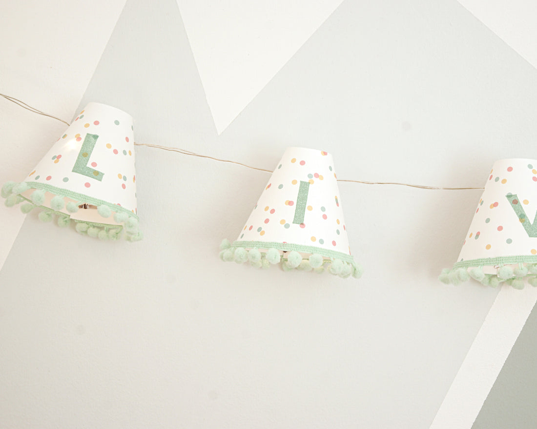 Personalised pom pom fairy lights in green