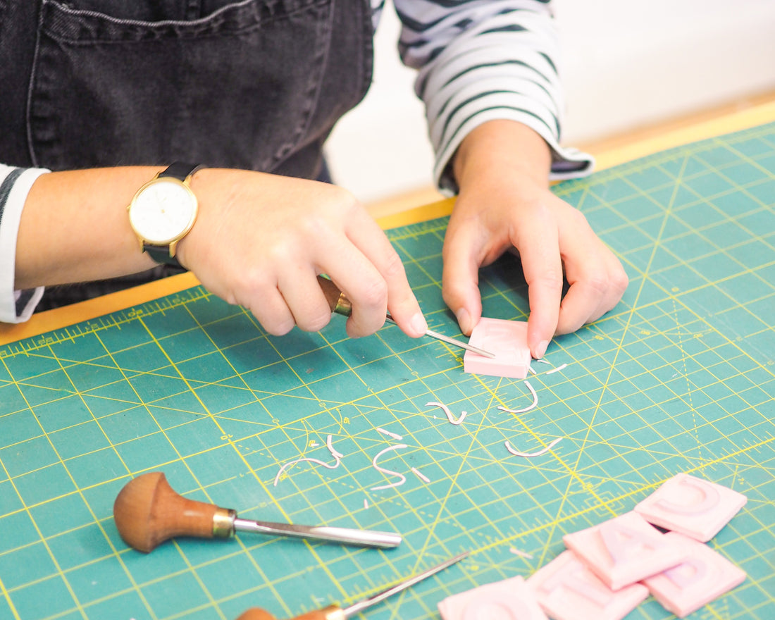 Carving lino during printed lampshade workshop starling studio