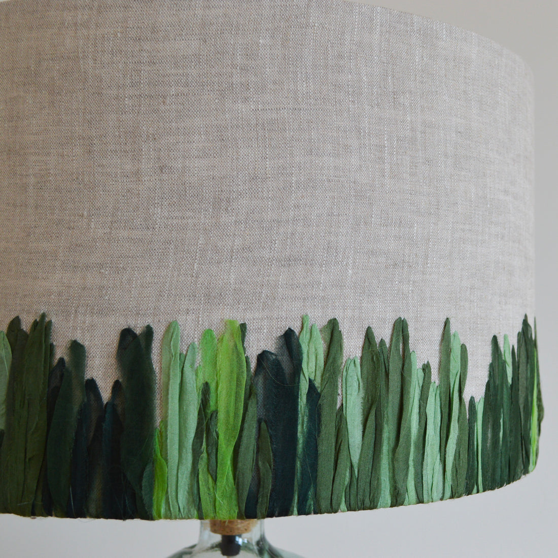 Close up of the hand embroidered green meadow lampshade