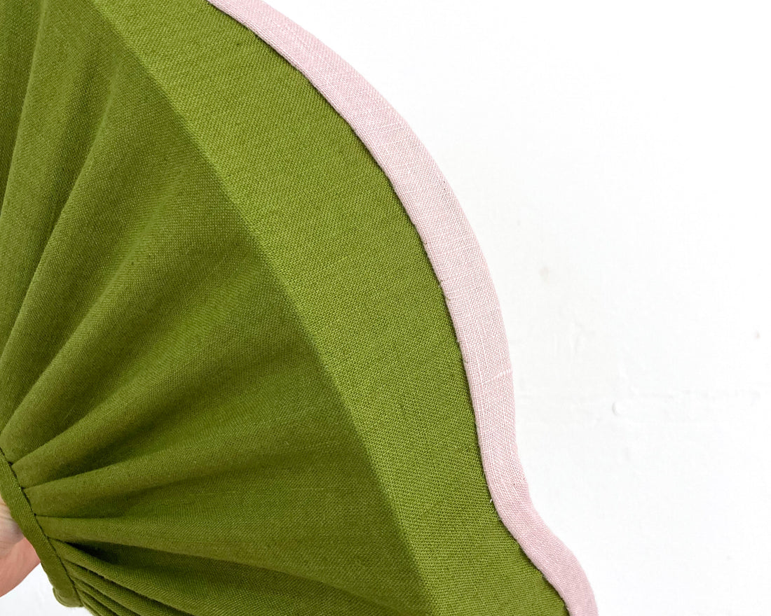 Detail of the pink linen scallop edge on our green moss pleated lampshade