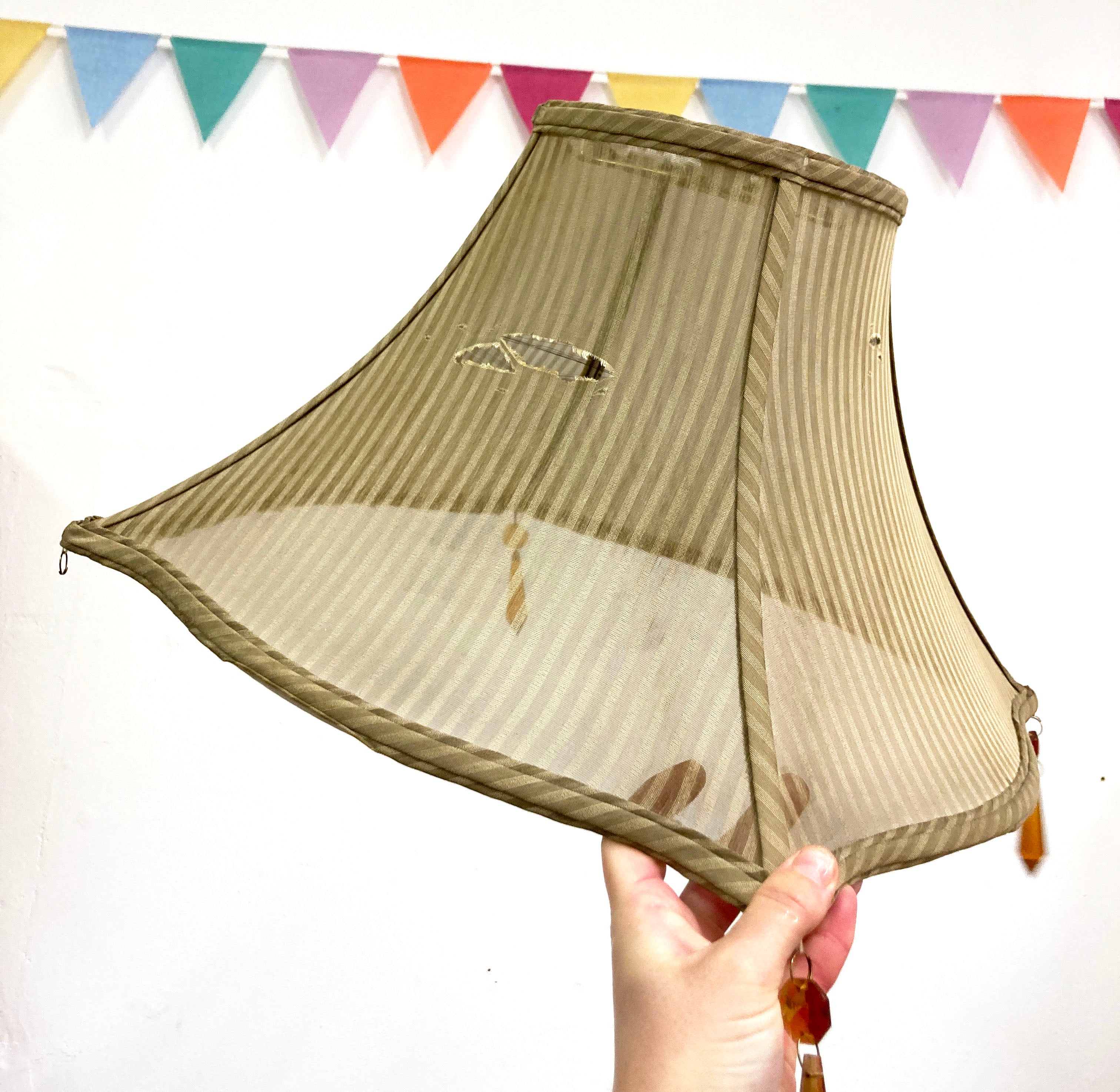 Panelled lampshade recovering before