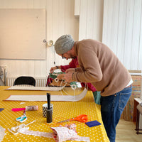 Person making a lampshade during one of Lume Lightings workshops