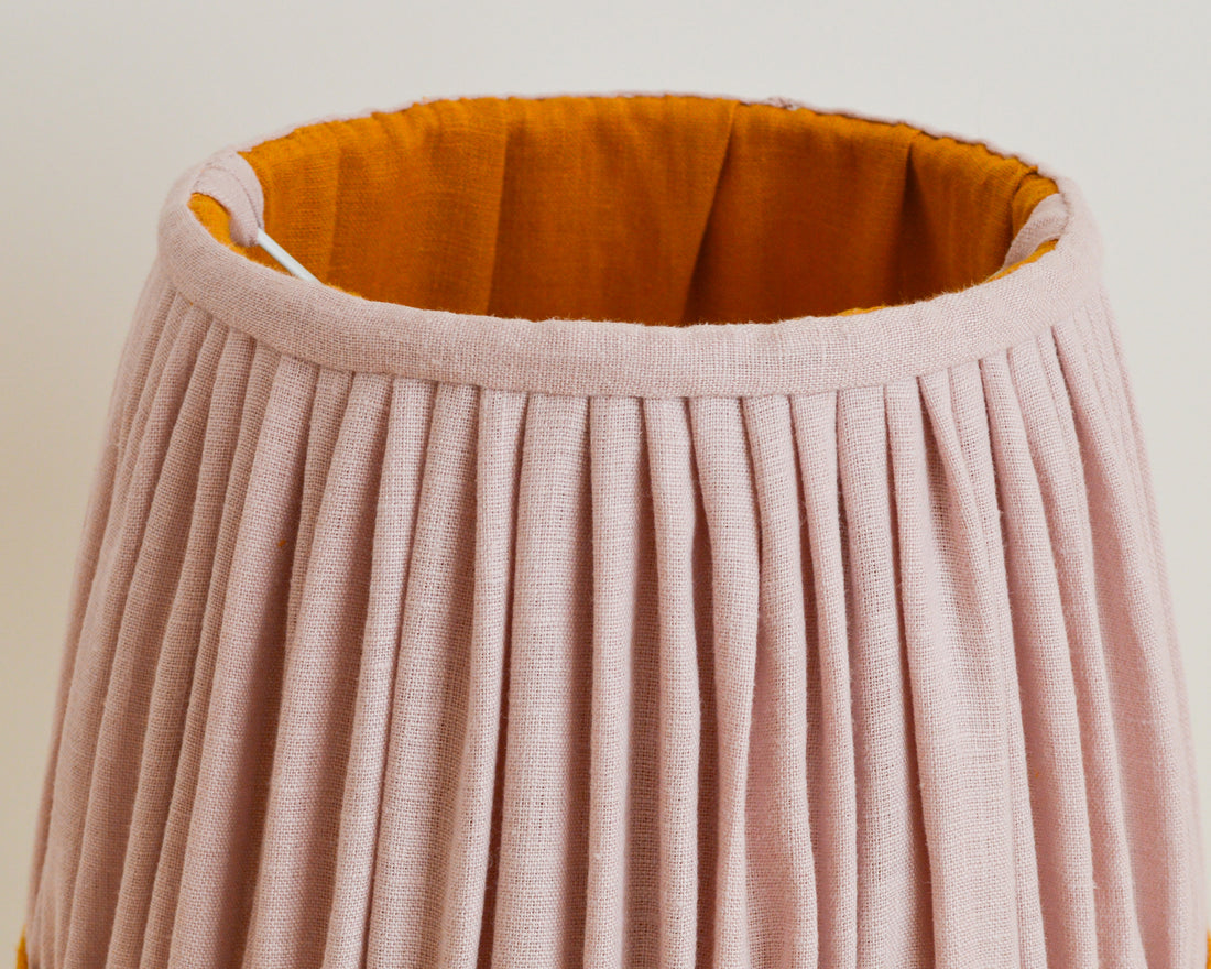 Close up detail of pink and mustard gathered linen french drum lampshade