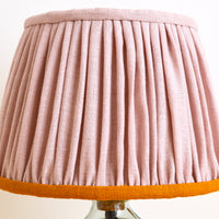 Dusty pink gathered lampshade with a mustard edge detail