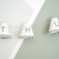 Personalised pom pom fairy lights in blue